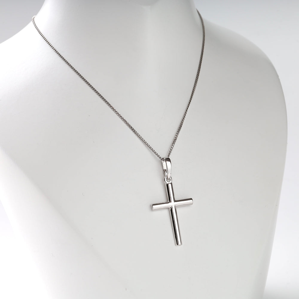 Sterling silver cross pendant necklace displayed on a mannequin.