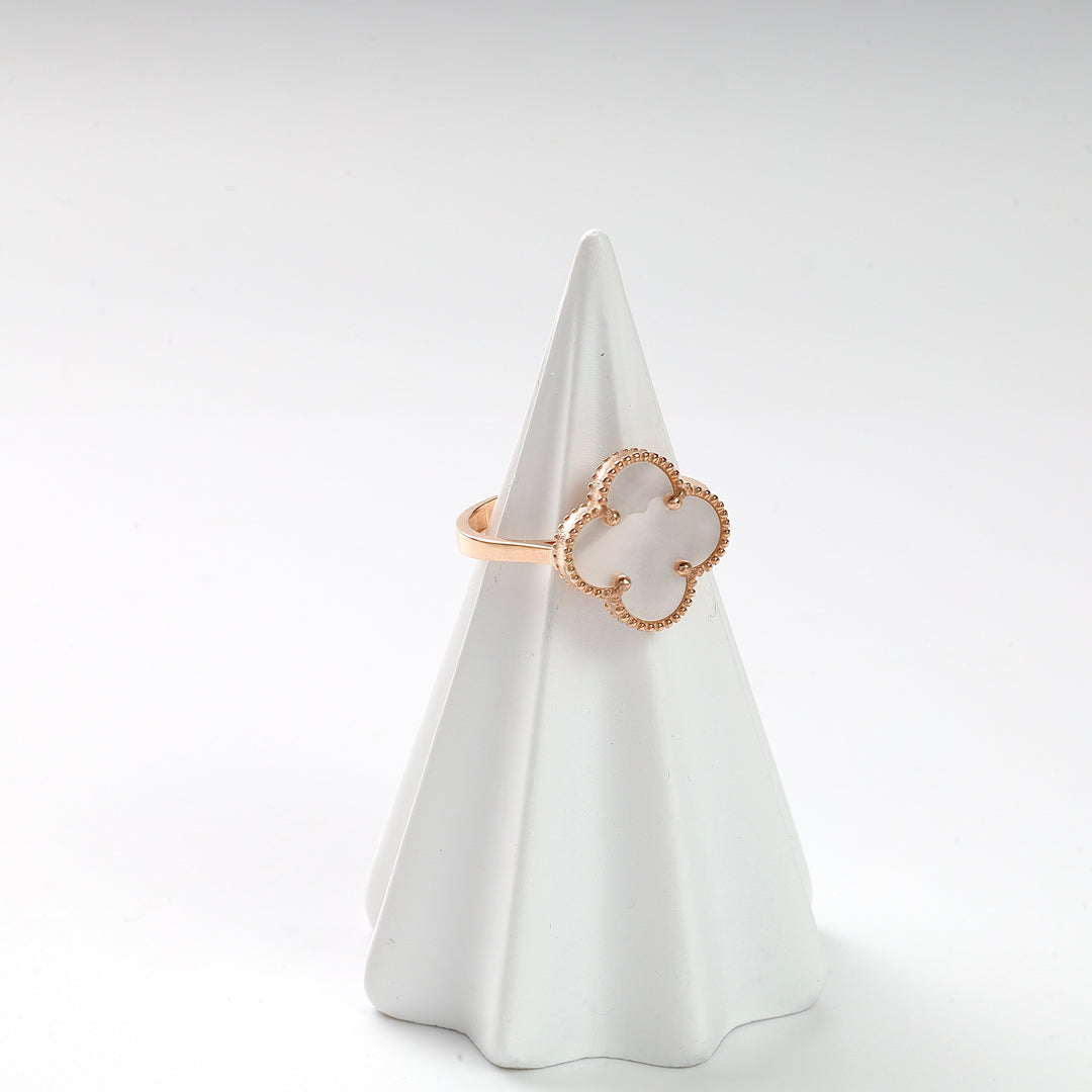 Gold clover mother of pearl ring with beaded edge detail displayed on a white ring holder.
