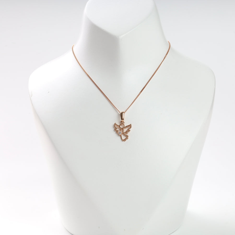 Rose gold angel pendant necklace with a clear gemstone, displayed on a white stand for jewelry, charm necklace.
