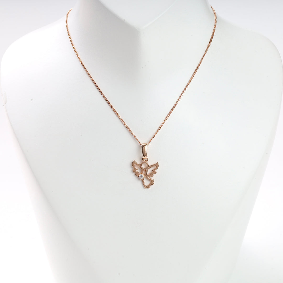Rose gold angel pendant necklace with a tiny clear stone, displayed on a white bust. Angel charm necklace, rose gold jewelry.