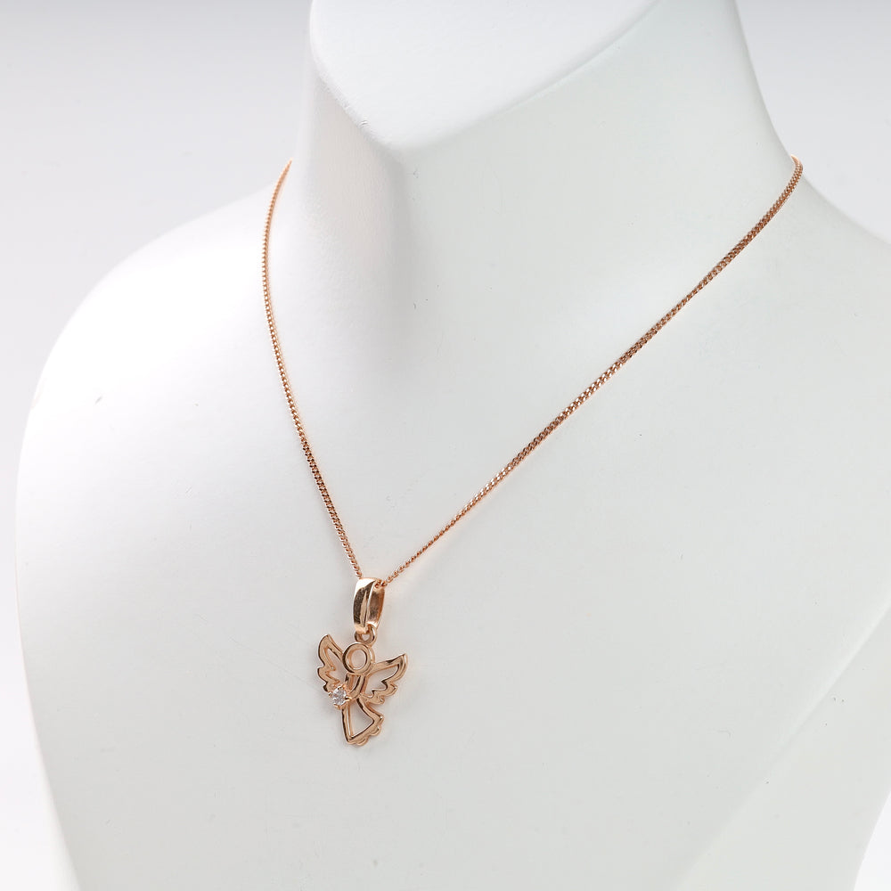 Rose gold chain necklace with an openwork angel pendant shown on a white display bust.