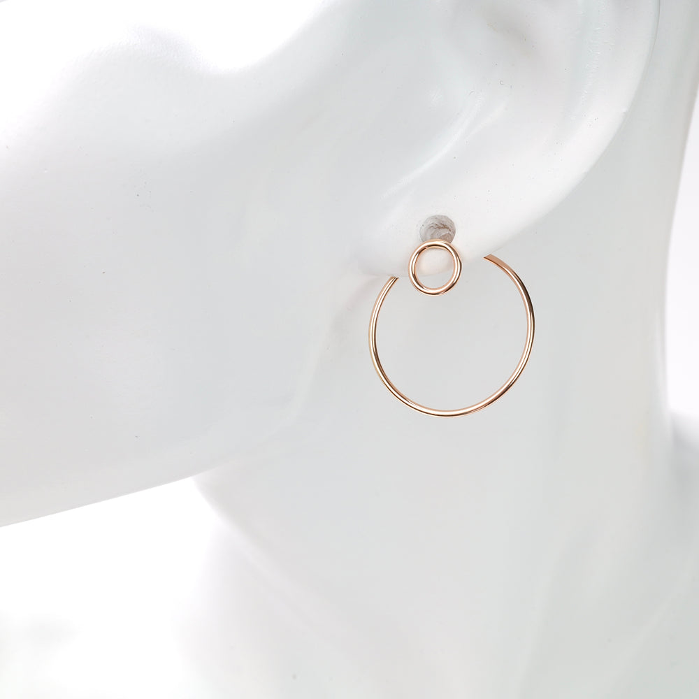 Rose gold double-circle hoop earring on a white mannequin ear, minimalist rose gold hoop earring.
