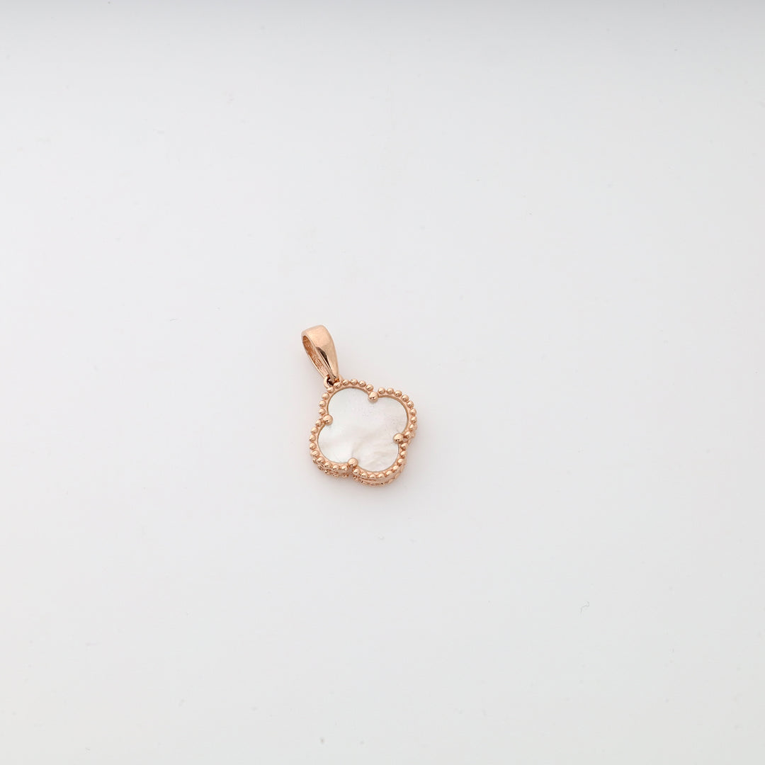 Gold flower pendant with mother of pearl center, beaded edge, shown on a plain white background.
