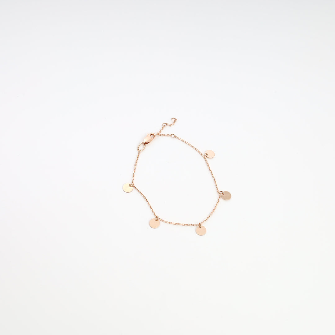 Delicate 14k gold disc charm chain bracelet on white background, minimalist Ukrainian Jewelry, dainty gold bracelet gift.