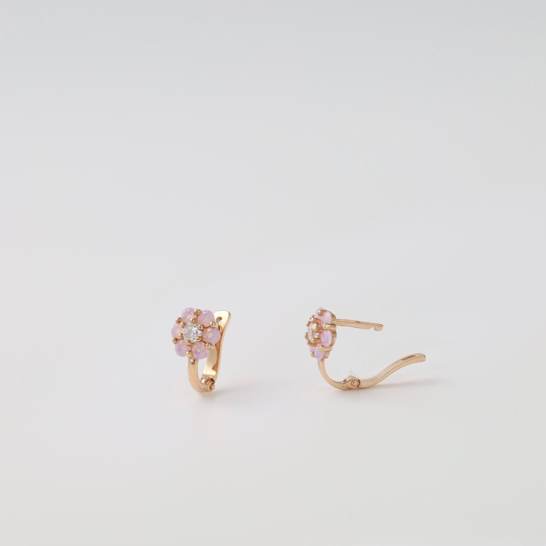 14k gold kids flower hoop earrings with pink stones and clear center gems on white background, Ukrainian Jewelry floral stud hoops.