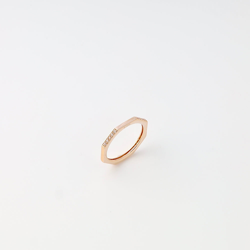 Minimalist 14k gold hexagon ring with small diamonds on top, modern stacking ring style, Ukrainian Jewelry on white background.