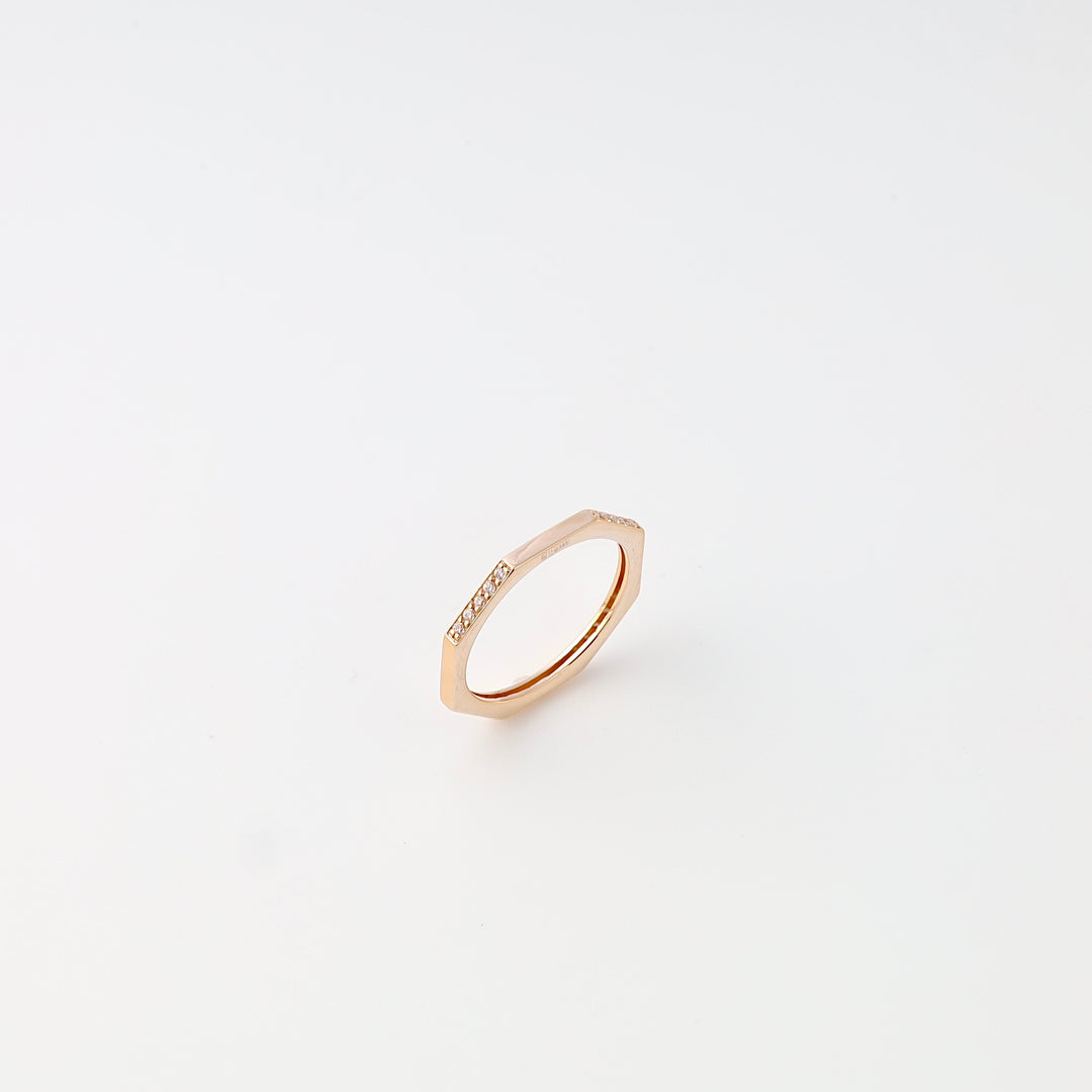 Minimalist 14k gold hexagon ring with small diamonds on top, modern stacking ring style, Ukrainian Jewelry on white background.