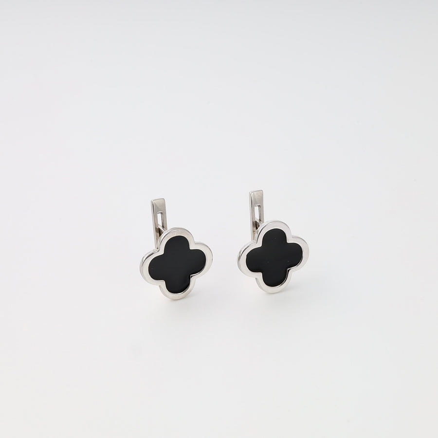 Sterling silver clover drop earrings with black enamel, displayed on white background, Ukrainian Jewelry silver dangle earrings.