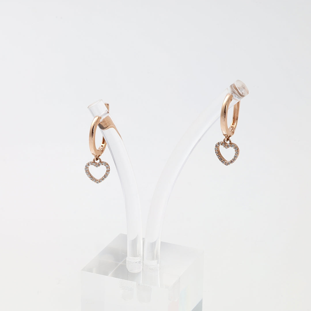 Rose gold heart hoop earrings with crystal accents, 14k gold dangle earrings on display, romantic Ukrainian Jewelry gift.