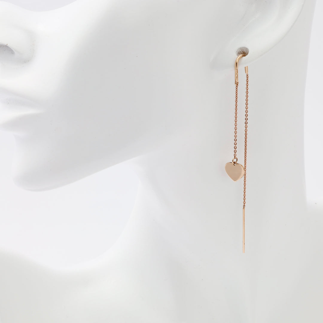 14k gold threader earring with heart charm on mannequin, minimalist dangle earring, Ukrainian Jewelry for women.
