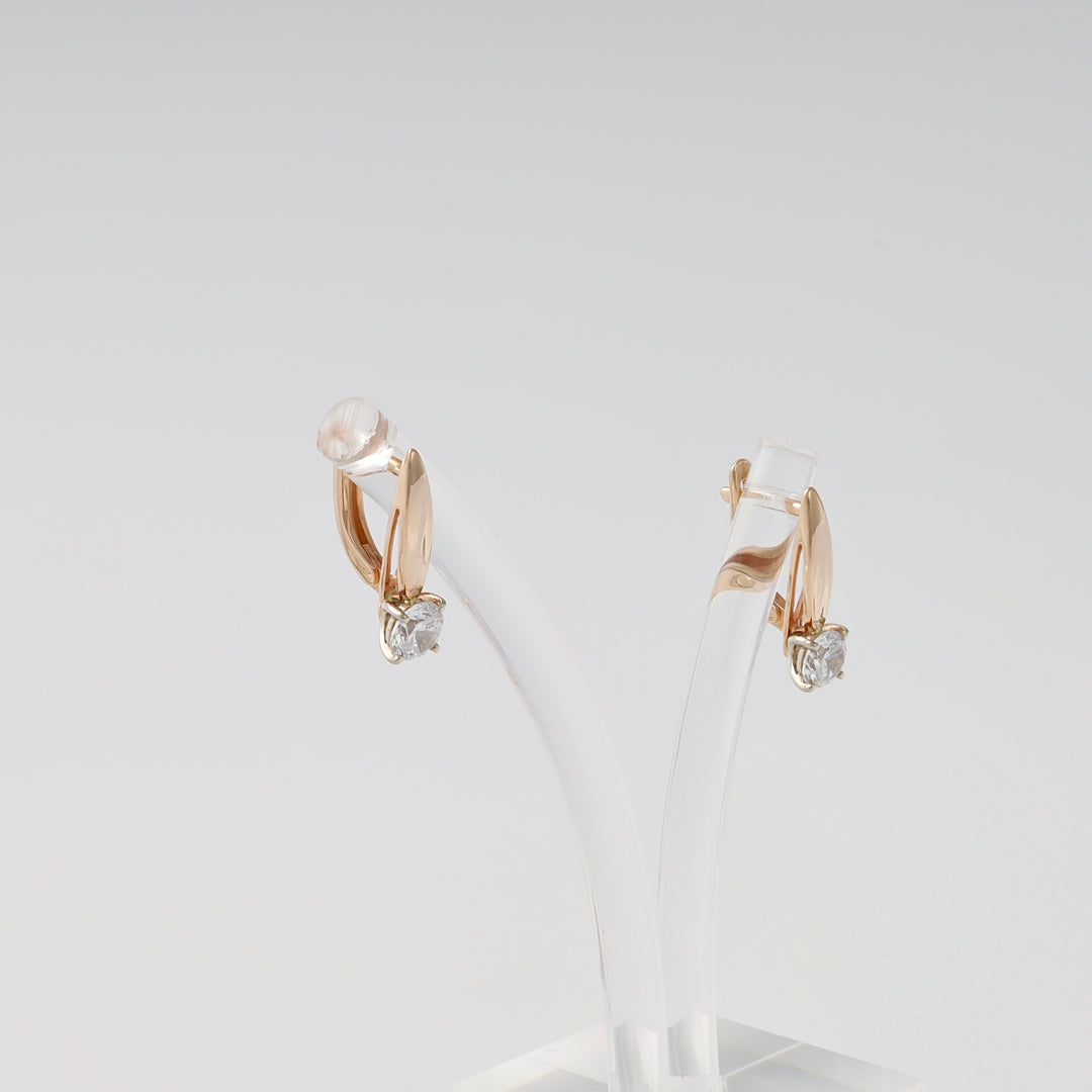 14k gold drop hoop earrings with single clear stone, displayed on stand, Ukrainian Jewelry, minimalist gold earrings gift.