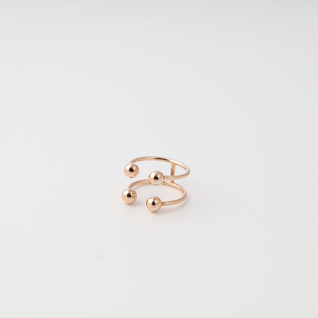 Minimalist 14k gold open ring with four ball ends on white background, modern adjustable band Ukrainian Jewelry for women.