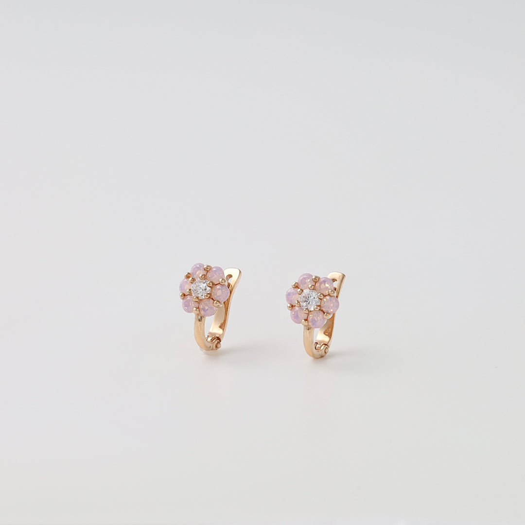 14k gold flower earrings with pink stones and crystals on white background, Ukrainian Jewelry, delicate gold hoop earrings for women.