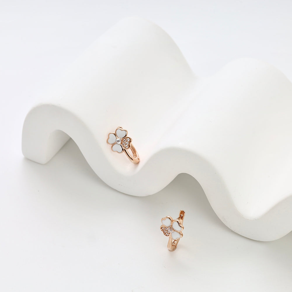 Rose gold 14k gold clover huggie earrings with white enamel and cubic zirconia, Ukrainian Jewelry, dainty hoop earrings for women.