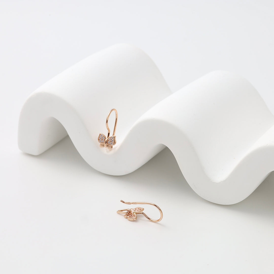 14k gold butterfly drop earrings with small crystals on white display, delicate dangle Ukrainian Jewelry, gold earrings gift.