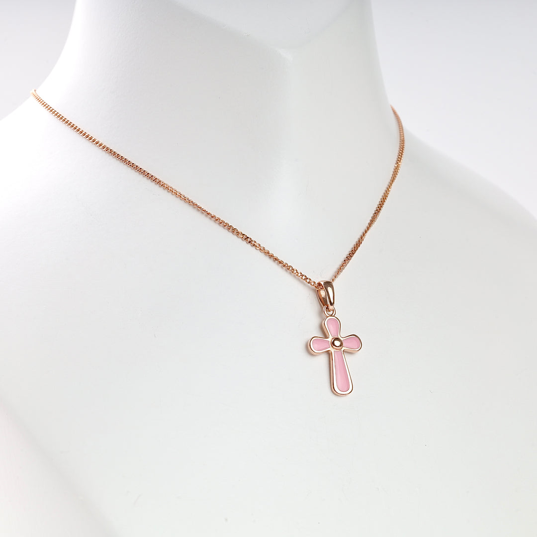 Rose gold necklace with a pink enamel cross pendant displayed on a white bust.