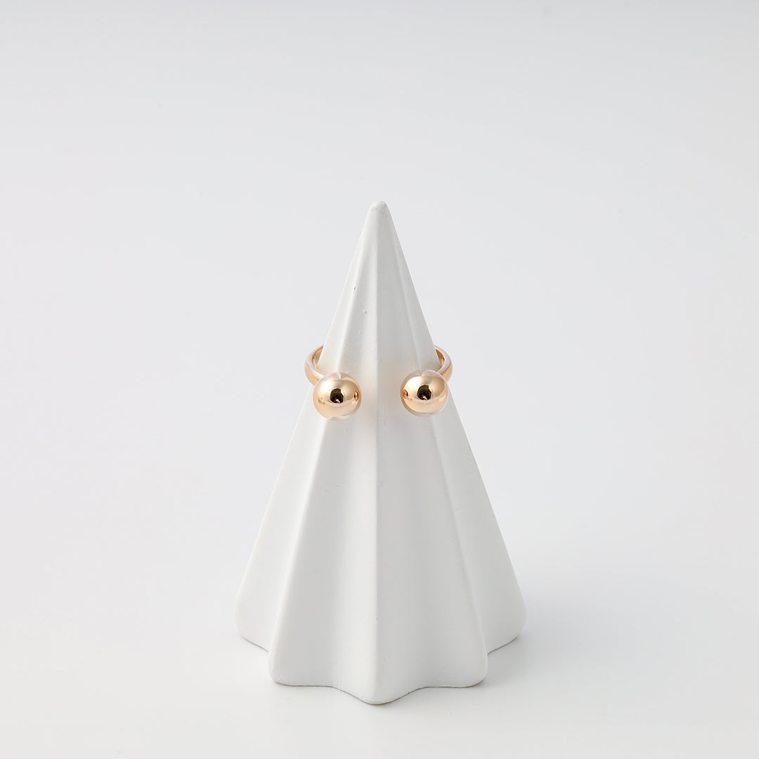 Minimalist 14k gold ball stud earrings on white display cone, Ukrainian Jewelry, simple gold stud earrings for everyday wear.