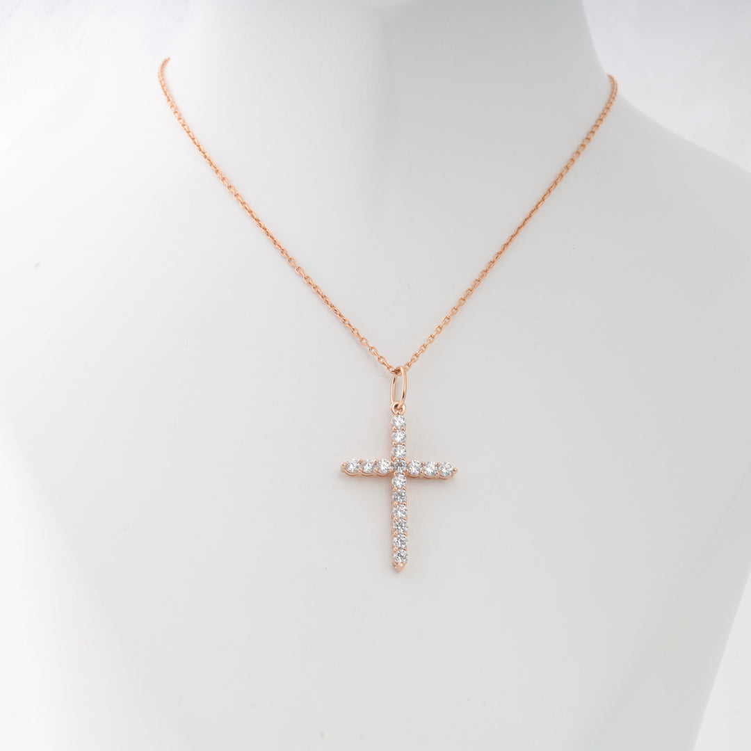 Rose gold chain necklace with a crystal cross pendant displayed on a white mannequin, Christian jewelry, gift necklace.