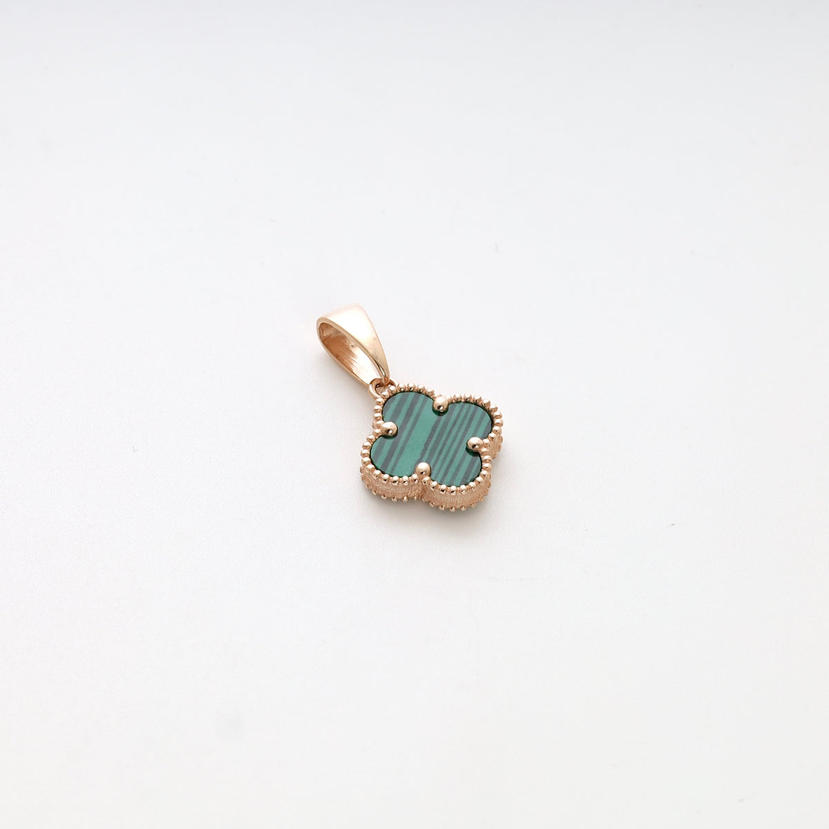 Gold clover pendant with green stone in beaded frame on white background, Ukrainian Jewelry, malachite gold necklace charm.