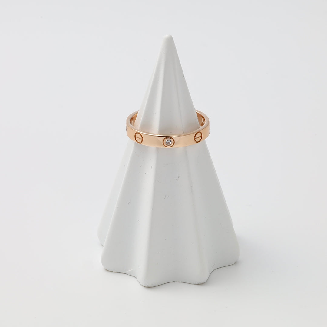 Rose 14k gold ring with single clear stone and engraved screw motifs on display cone, Ukrainian Jewelry, minimalist gold band.