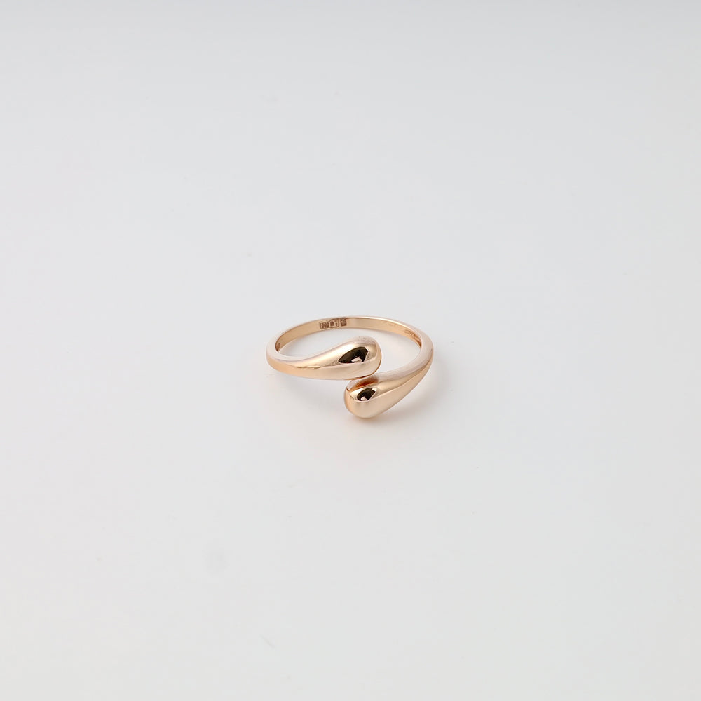 Minimalist 14k gold open ring with teardrop ends on white background, modern stackable Ukrainian Jewelry gold ring for women.