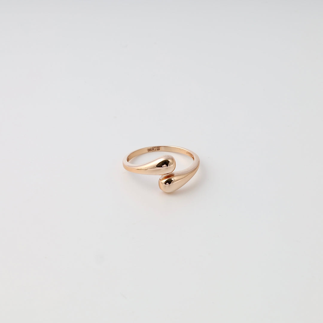 Minimalist 14k gold open ring with teardrop ends on white background, modern stackable Ukrainian Jewelry gold ring for women.