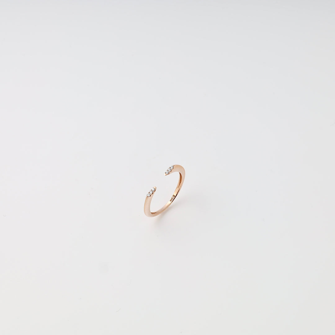 Delicate 14k gold open ring with small crystal accents on white background, minimalist stacking Ukrainian Jewelry, dainty gold ring.