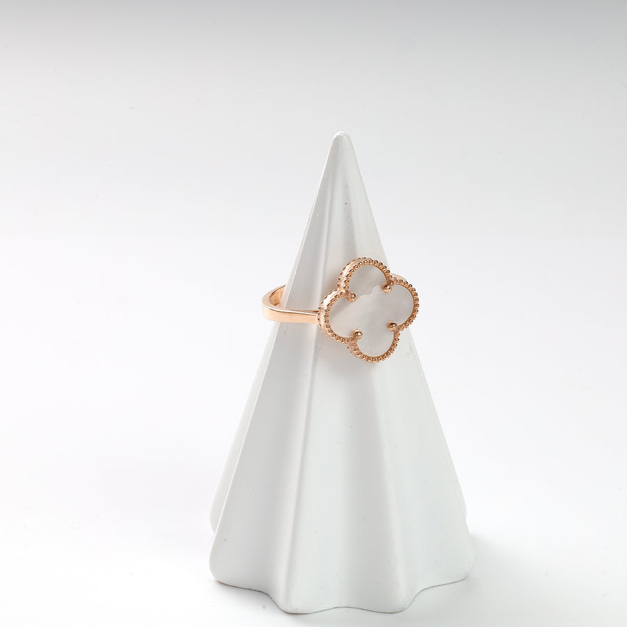 Gold clover mother of pearl ring with beaded edge detail displayed on a white ring holder.
