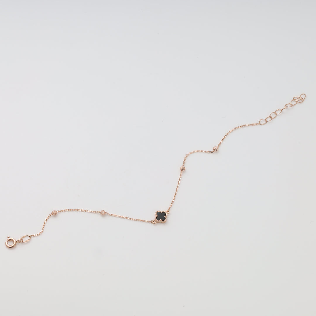 Delicate 14k gold chain bracelet with black clover charm, adjustable clasp, Ukrainian Jewelry, dainty gold bracelet gift.