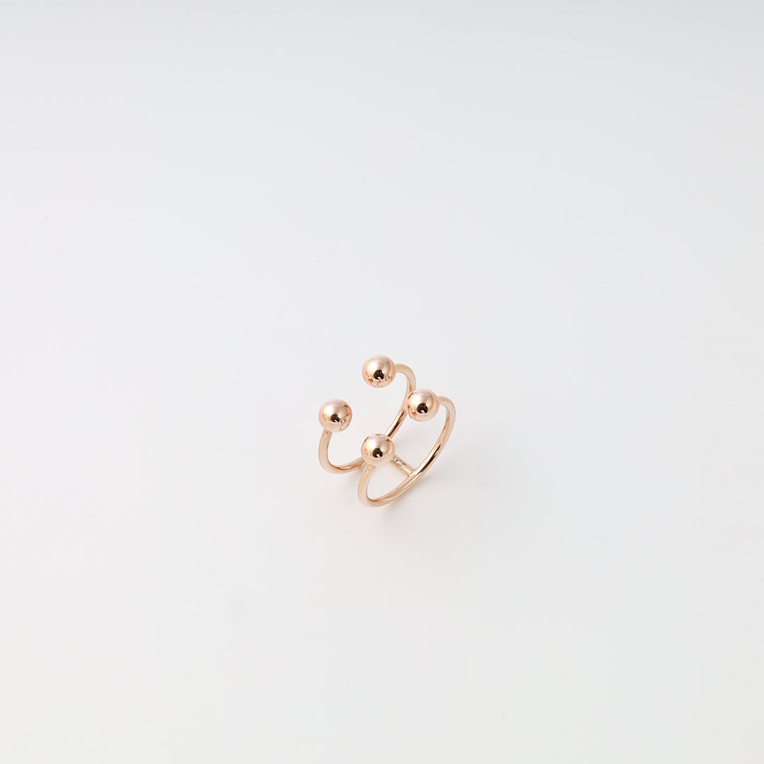 Open double-band 14k gold ring with four bead accents on white background, minimalist Ukrainian Jewelry, modern gold stacking ring.