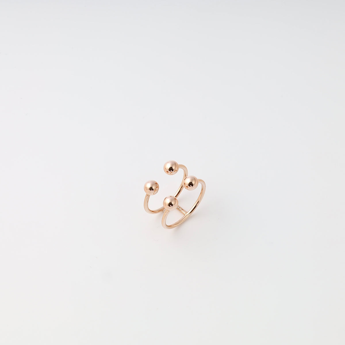 Open double-band 14k gold ring with four bead accents on white background, minimalist Ukrainian Jewelry, modern gold stacking ring.