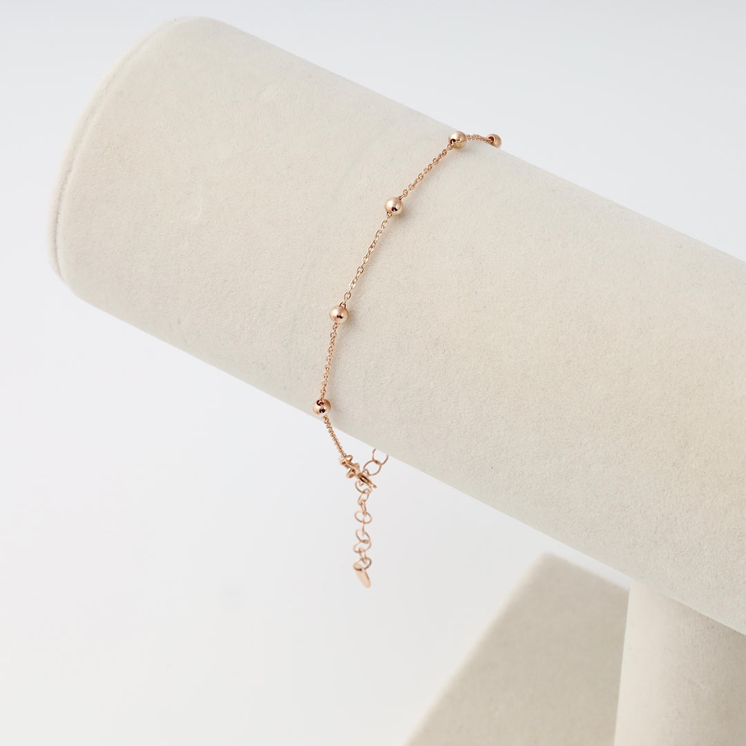Delicate 14k gold beaded chain bracelet with extender on display stand, minimalist Ukrainian Jewelry for women, dainty gold bracelet.