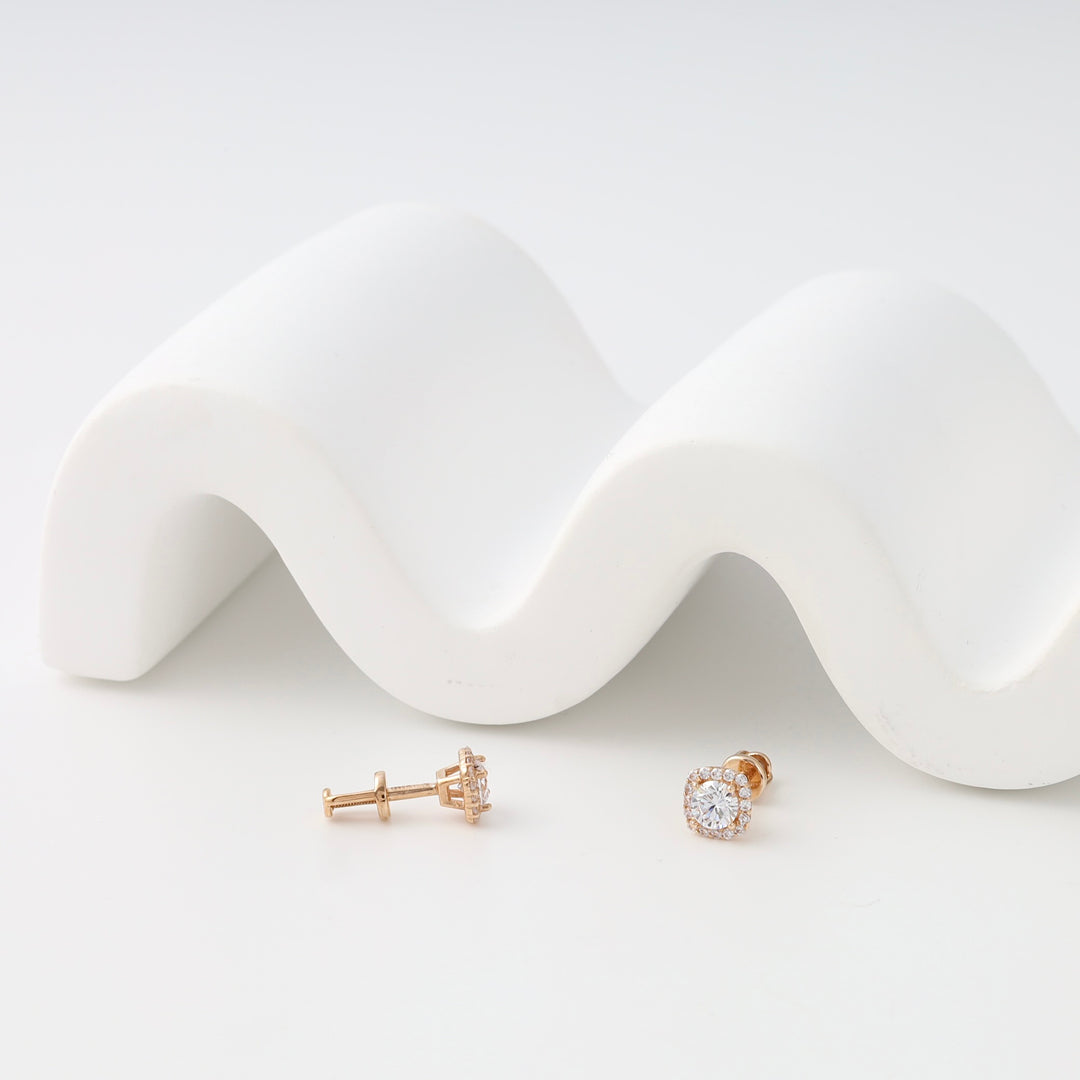 14k gold diamond halo stud earrings on white display, classic Ukrainian Jewelry, perfect gold stud earrings for everyday wear.