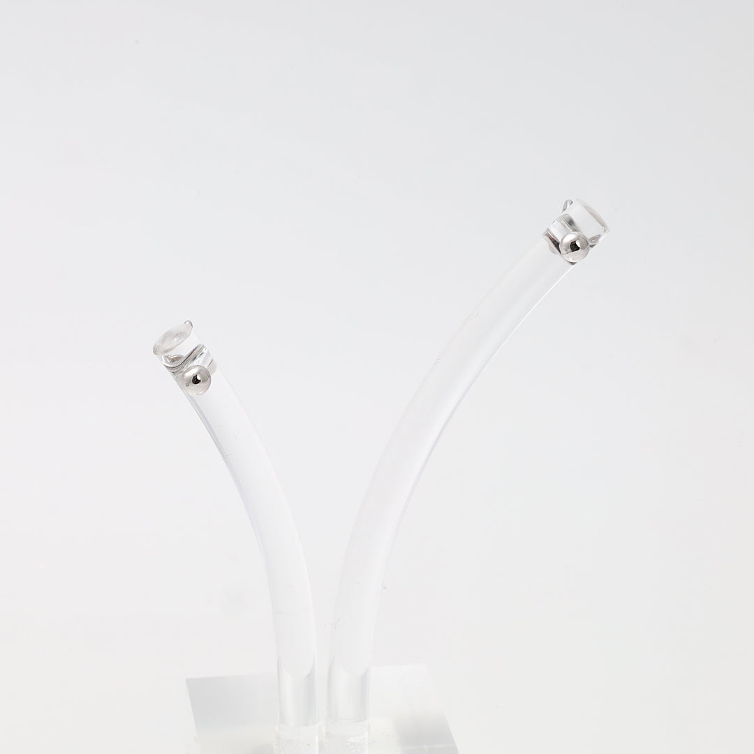 Sterling silver stud earrings with clear round stones on white display, minimalist Ukrainian Jewelry, simple silver stud earrings.