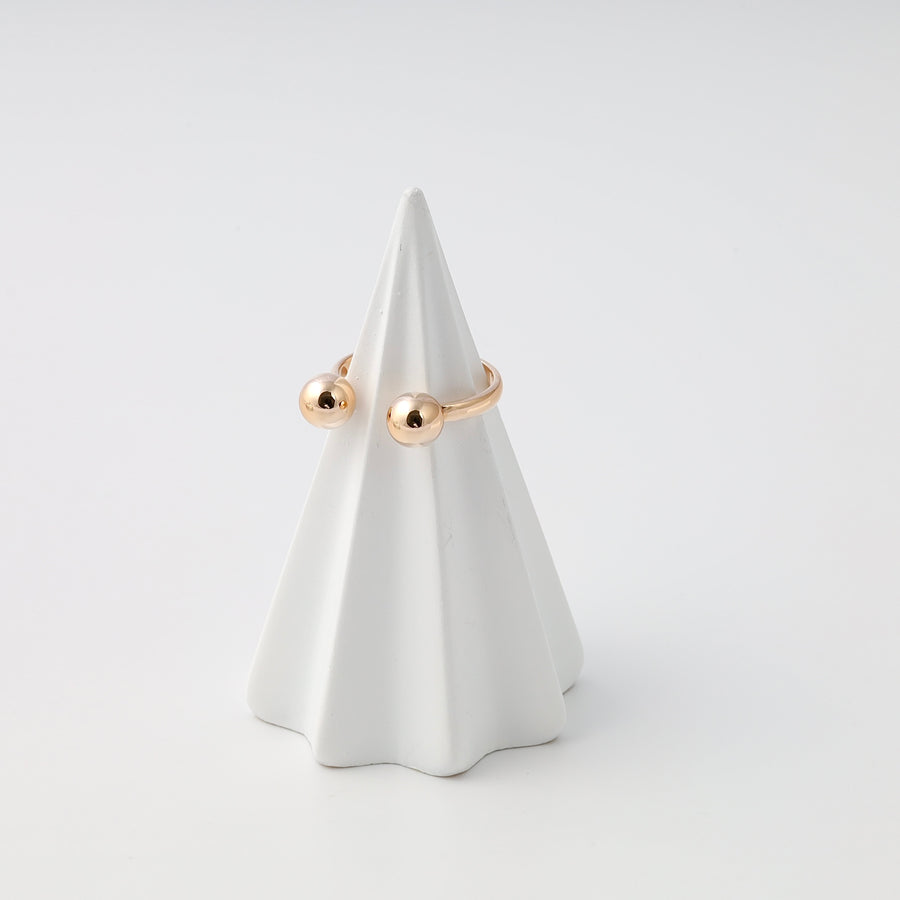 Minimalist 14k gold open ring with two ball ends on a white stand, modern Ukrainian Jewelry, simple gold stacking ring.