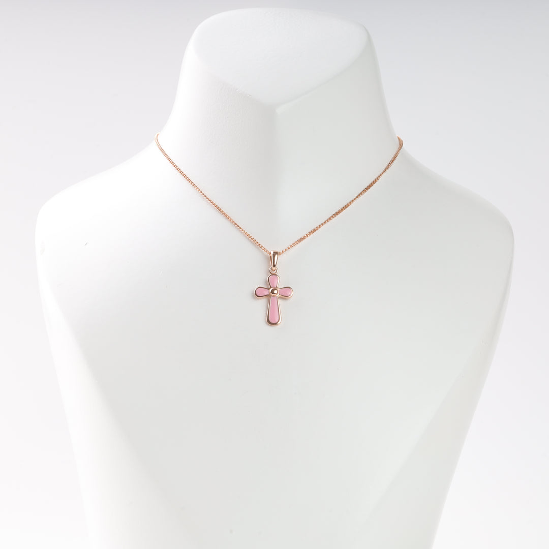 Rose gold necklace with a pink enamel cross pendant displayed on a white bust.