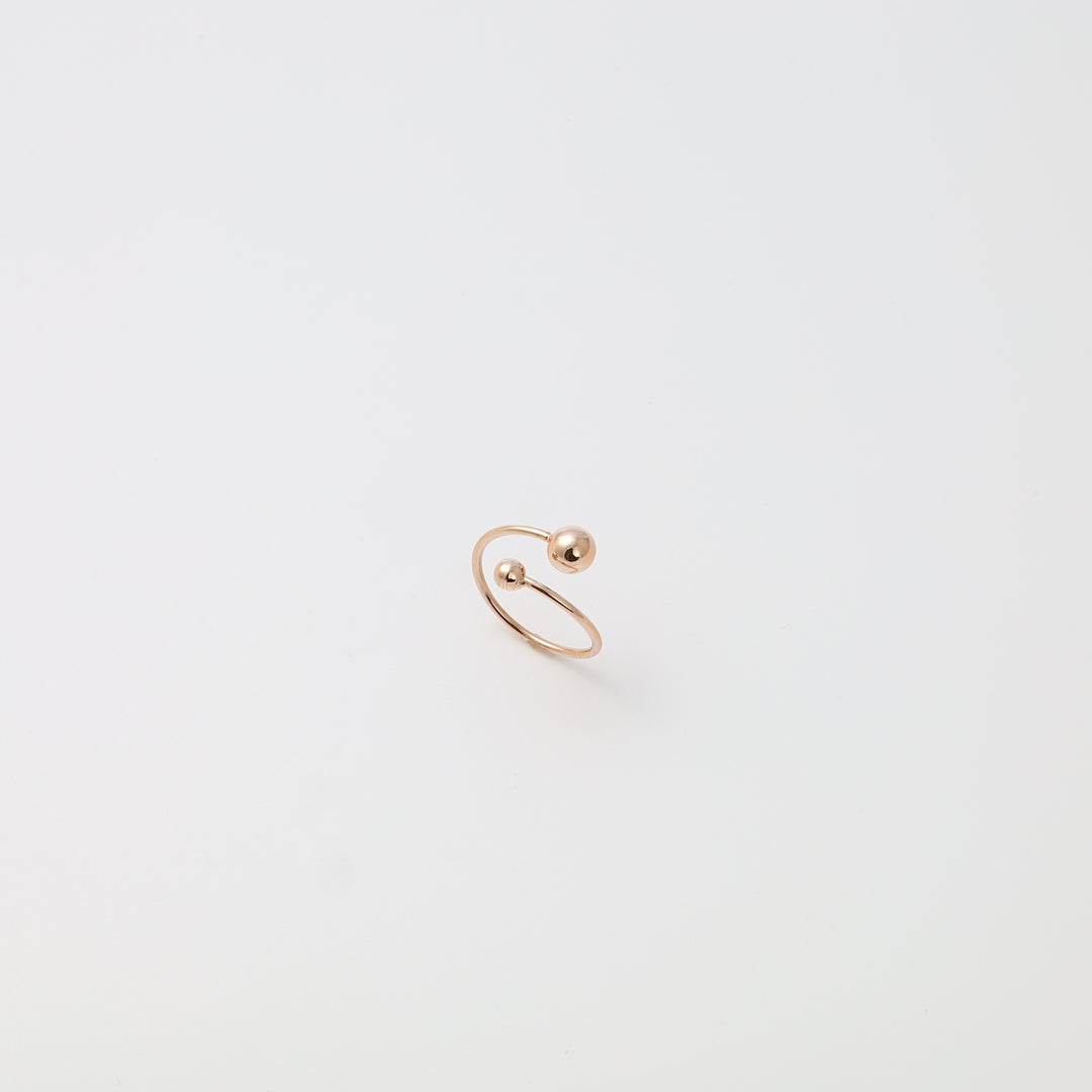 Minimalist 14k gold open ring with two ball ends on white background, modern stackable Ukrainian Jewelry, dainty gold ring.