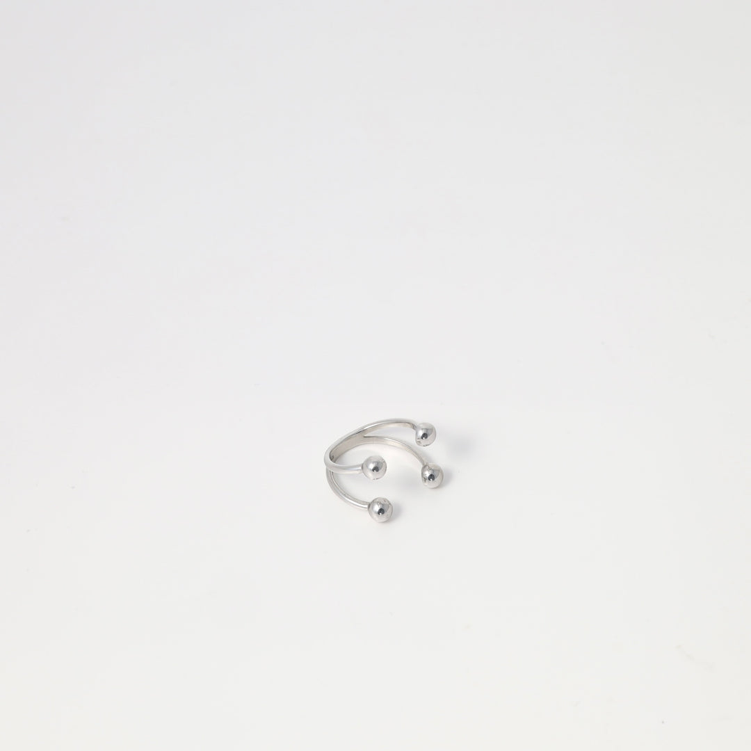 Sterling silver open ring with three ball ends on white background, minimalist adjustable jewelry, Ukrainian Jewelry for modern ring buyers.