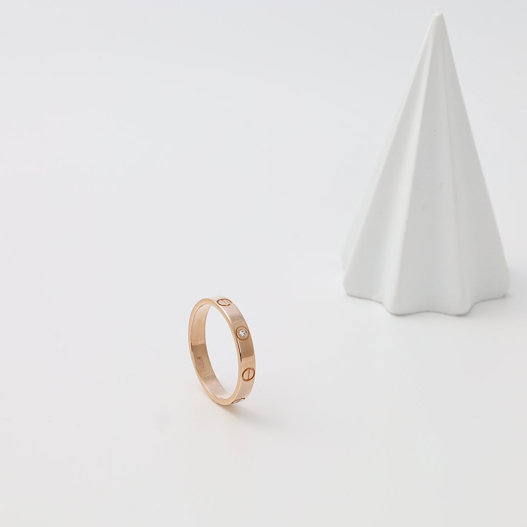 14k gold band ring with small diamonds on white display, minimalist wedding ring Ukrainian Jewelry, simple gold ring gift.