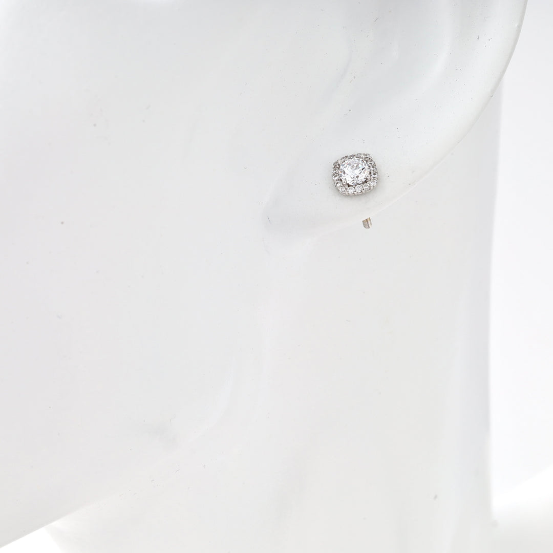 Sterling silver cushion halo stud earring with clear stones on model ear, Ukrainian Jewelry, silver stud earrings gift.
