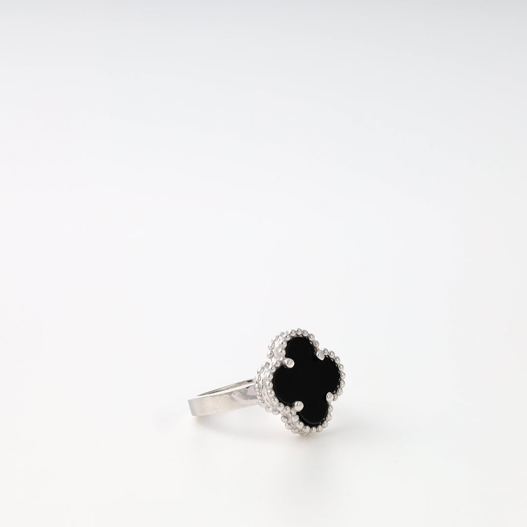 Sterling silver ring with black clover-shaped stone on white background, elegant Ukrainian Jewelry, silver fashion ring gift.