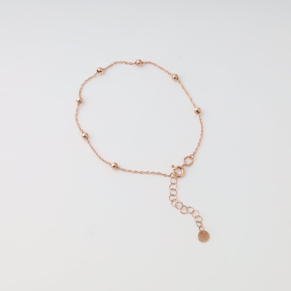 14k gold beaded chain bracelet with extender and disc charm on white background, delicate Ukrainian Jewelry, minimalist gold bracelet.