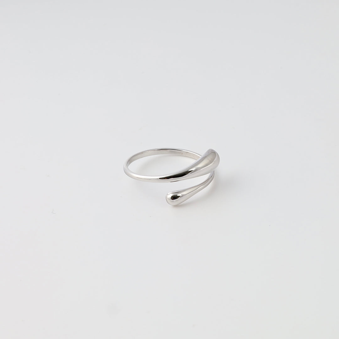 Sterling silver wrap ring with teardrop ends on white background, minimalist statement ring, Ukrainian Jewelry for women.