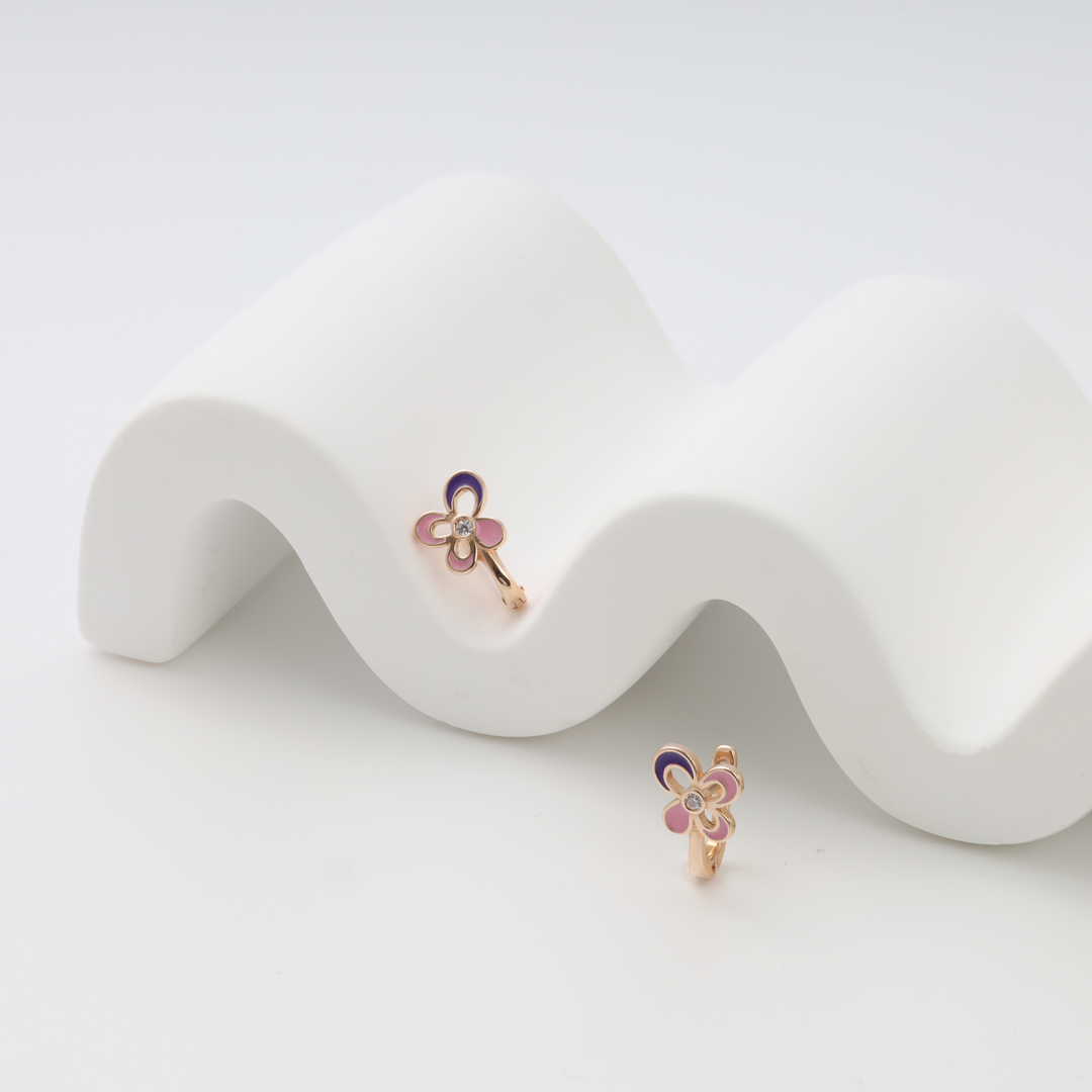 Gold flower earrings with pink and purple enamel and small stone center on white display, Ukrainian Jewelry, kids gold hoop earrings.