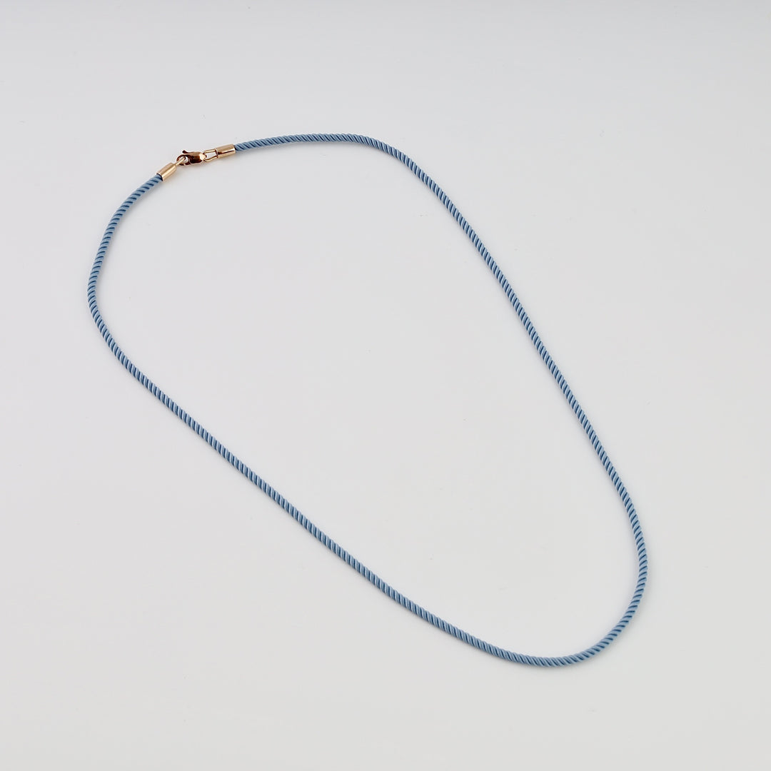 Blue cord necklace with small gold clasp, minimalist Ukrainian Jewelry, simple gold chain necklace for everyday wear.