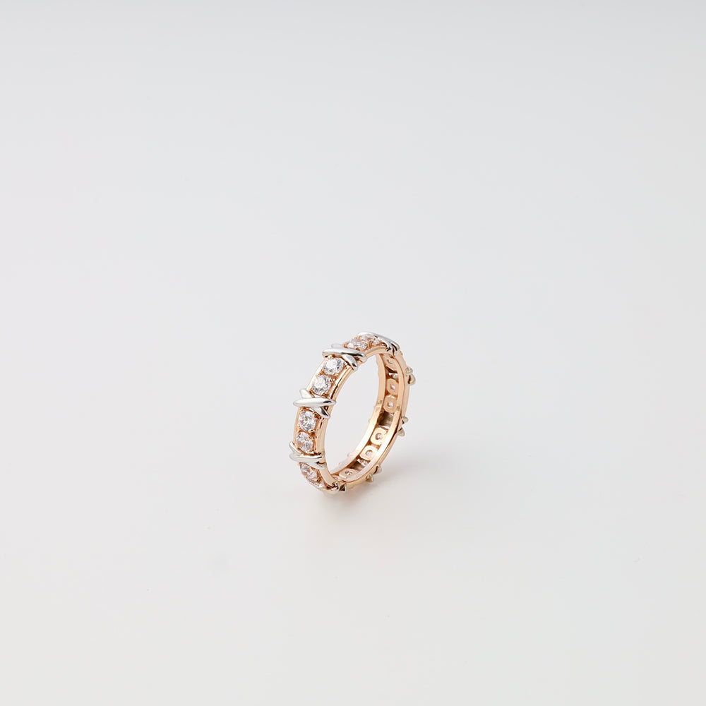 14k gold eternity ring with round clear stones on white background, Ukrainian Jewelry diamond band, gold engagement ring.