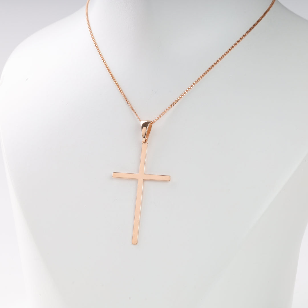Rose gold cross pendant necklace with a thin box chain displayed on a white mannequin bust.
