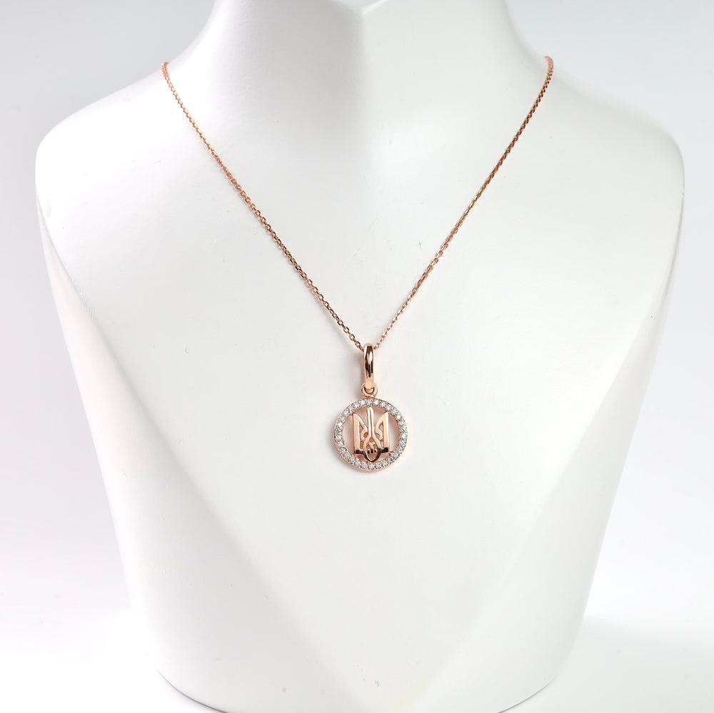 Rose gold pendant necklace with diamond accents displayed on a mannequin bust.