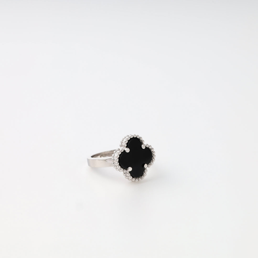 Sterling silver ring with black clover stone on white background, Ukrainian Jewelry, minimalist silver ring, black stone ring.