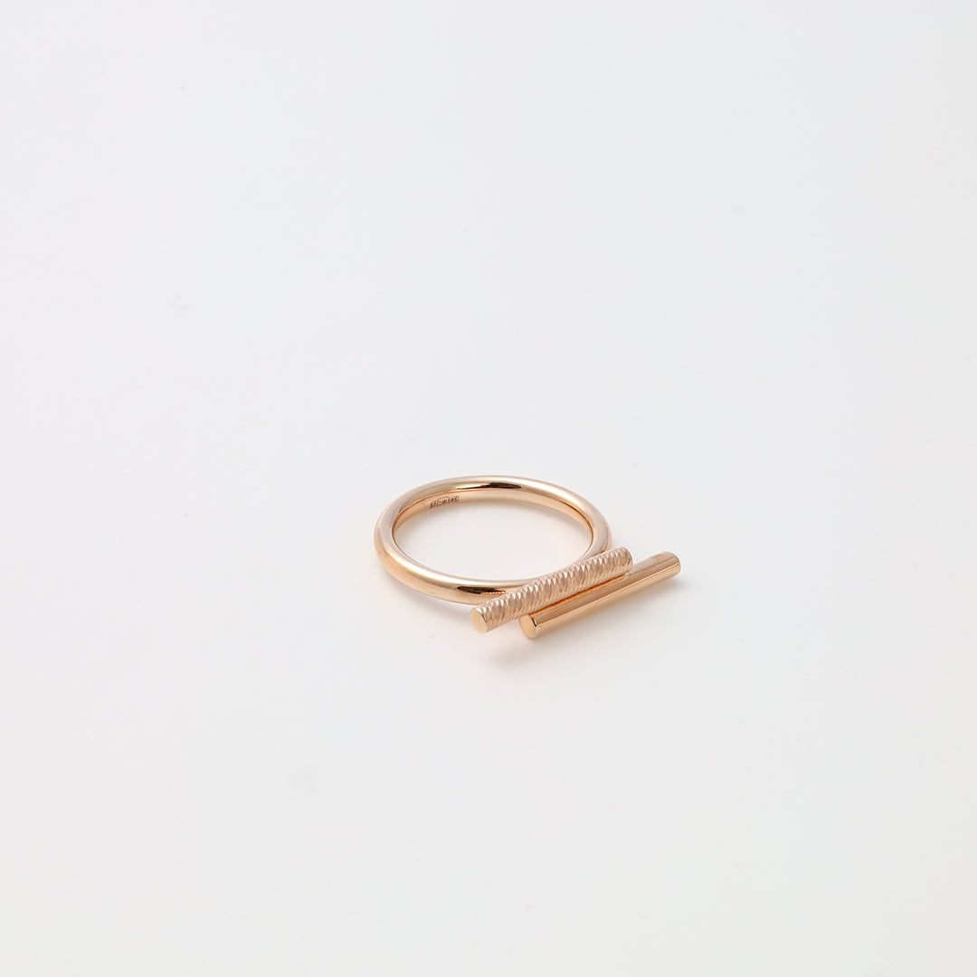 Minimalist 14k gold bar ring with textured rod detail on white background, modern stackable Ukrainian Jewelry for women.